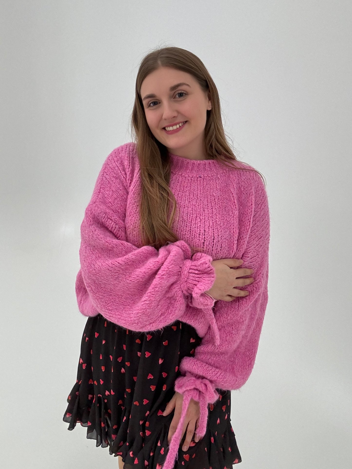 Kuschelweicher Pullover mit Rüschärmeln zum binden pink