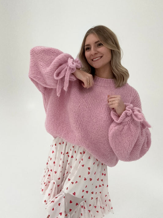 Kuschelweicher Pullover mit Rüschärmeln zum binden rosa