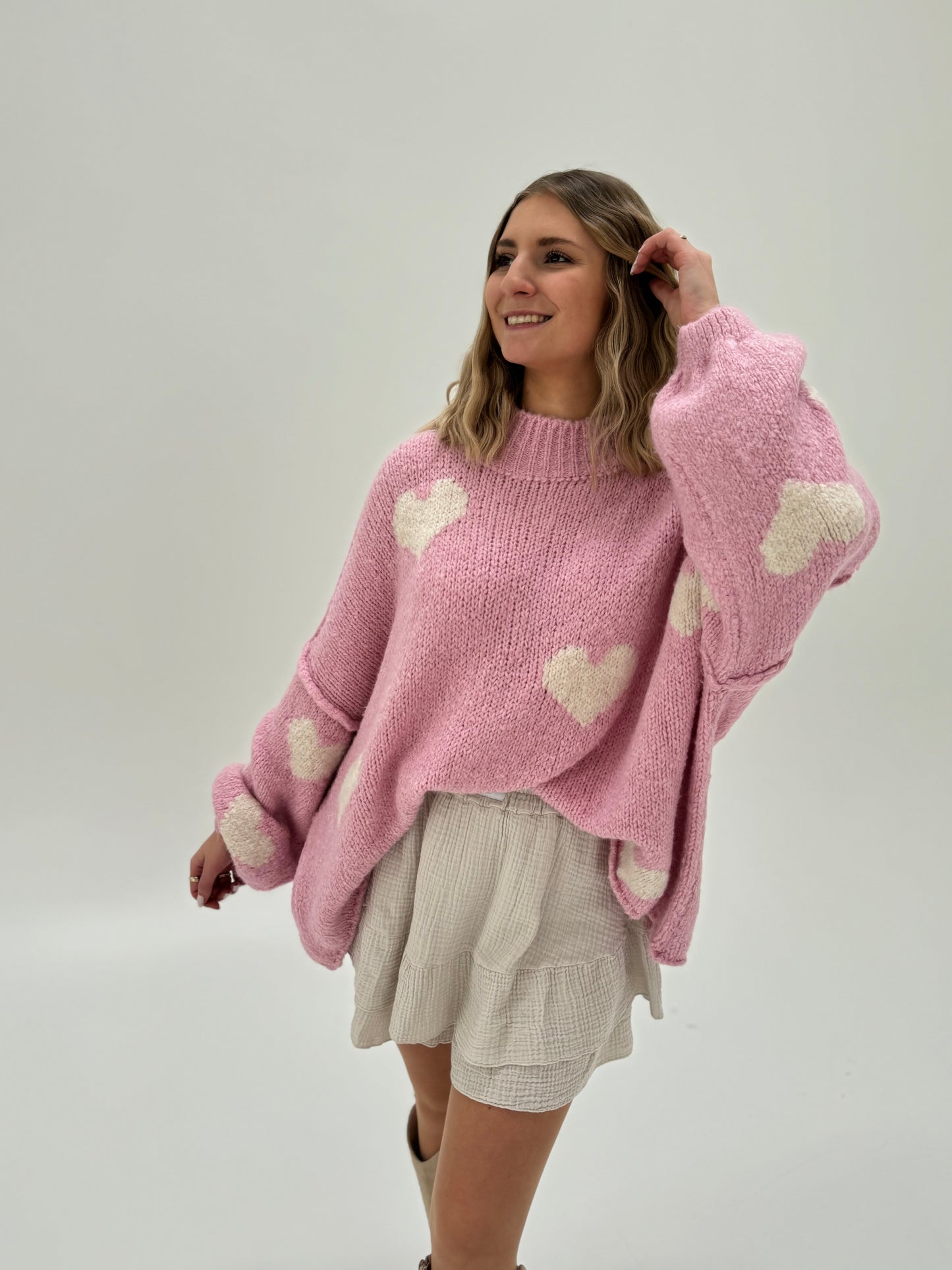 Kuschelweicher Pullover rosa mit weißen Herzen