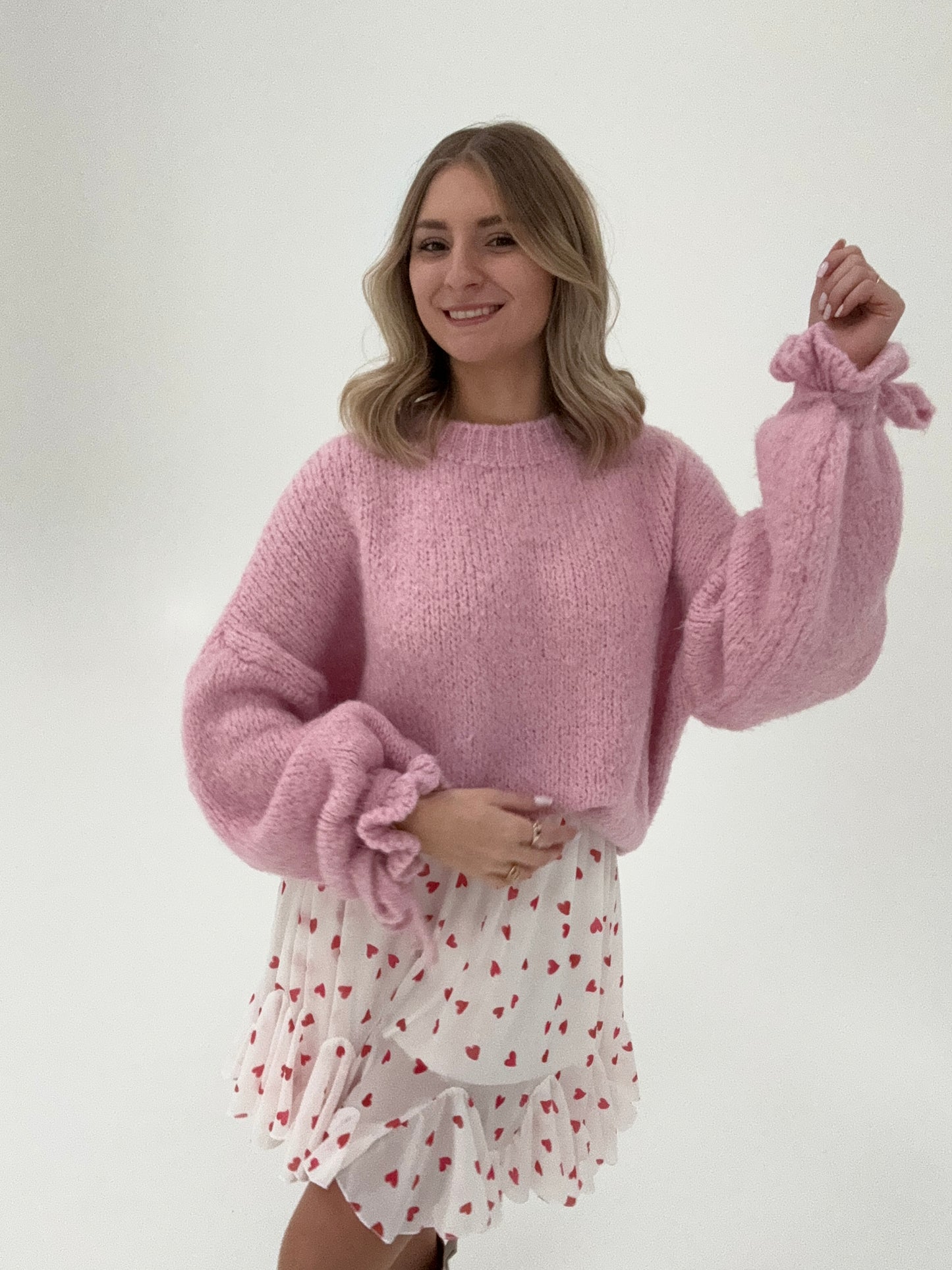 Kuschelweicher Pullover mit Rüschärmeln zum binden rosa